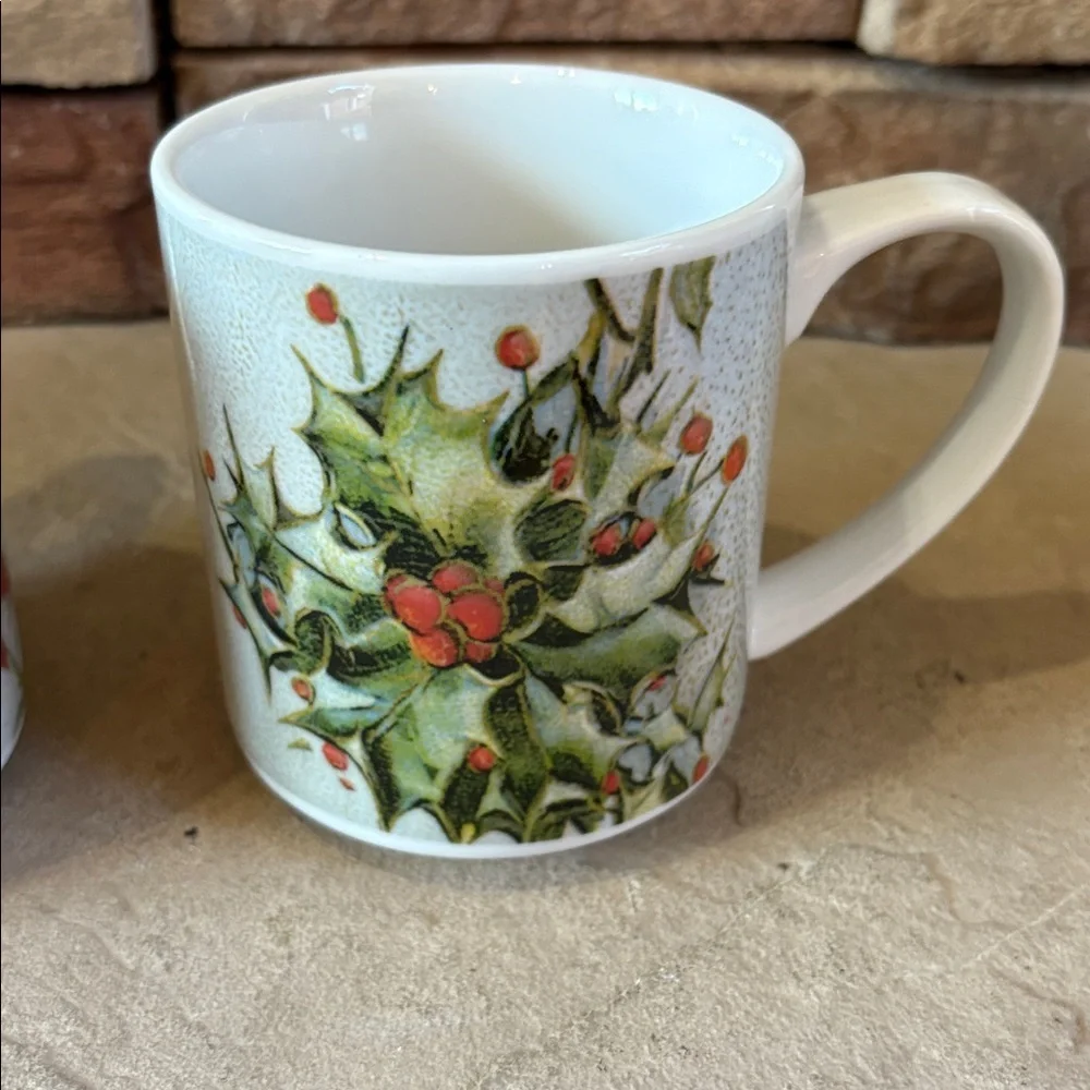 Pottery Barn ceramic holiday mugs with Holly and poinsettias